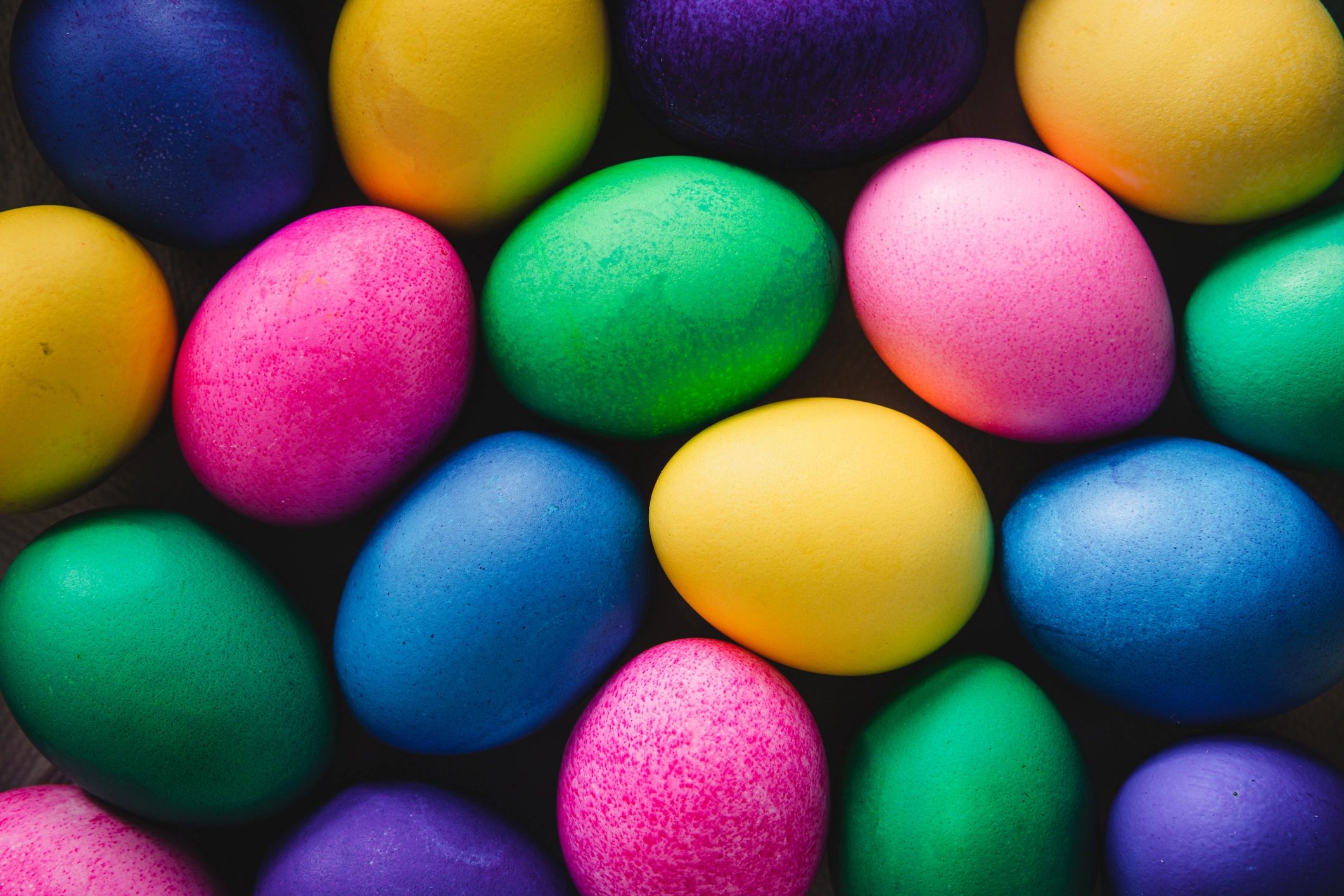 Colourful lekkerklei playdough balls on a wooden surface